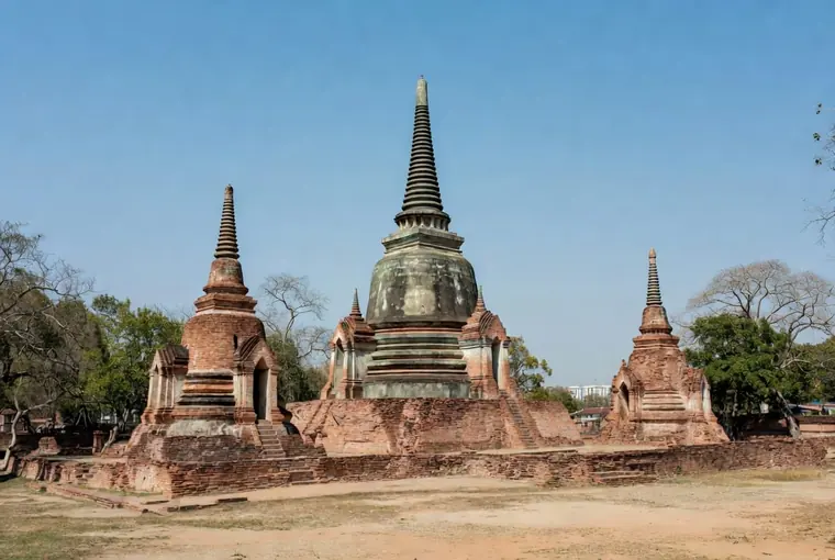 Three classic chedis of Wat Phra Si Sanphet in Ayutthaya under blue sky