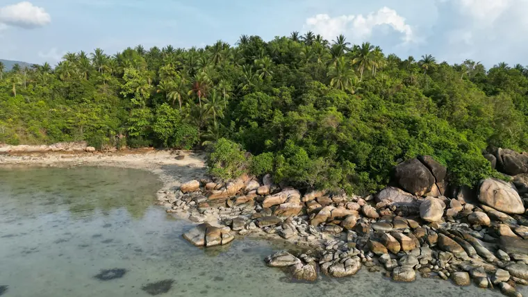 Aerial view of Koh Larn island showing multiple turquoise bays and beaches