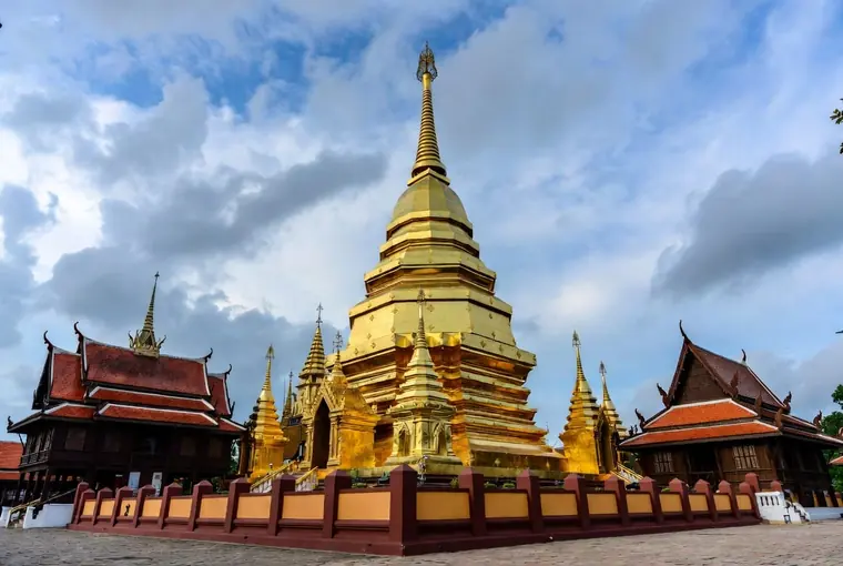 Golden chedi and Lanna architecture at Wat Phra That Lampang Luang