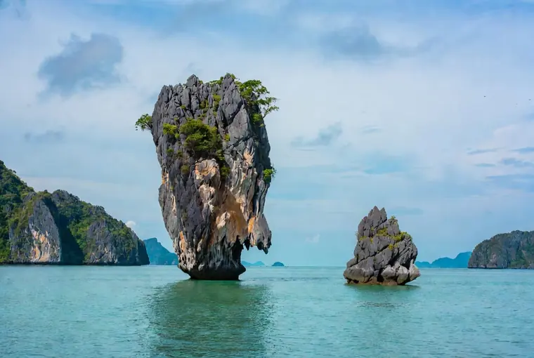 Iconic limestone pillar of James Bond Island rising from the water in Phang Nga Bay