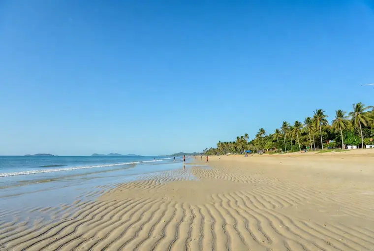Wide sandy Mae Ramphueng Beach in Rayong with calm sea and palm trees