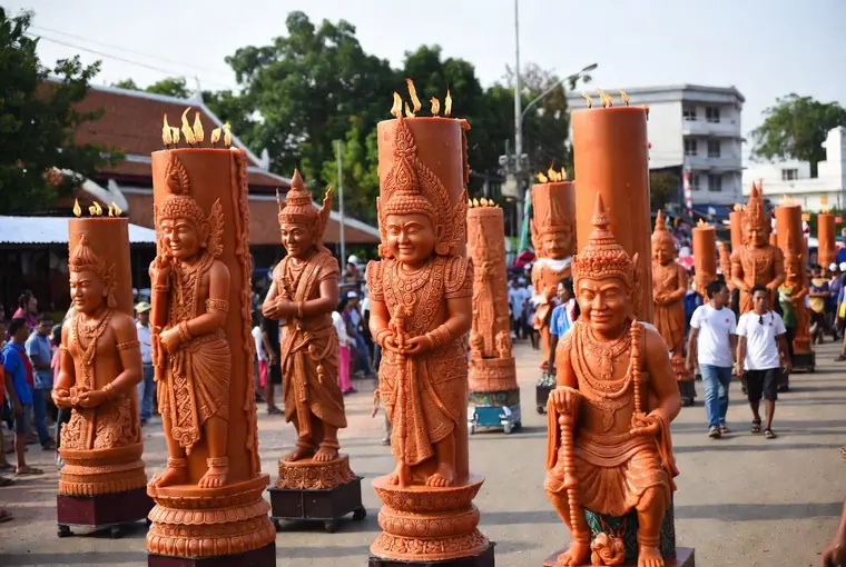 Large elaborately carved wax candle sculptures at the Ubon Ratchathani Candle Festival