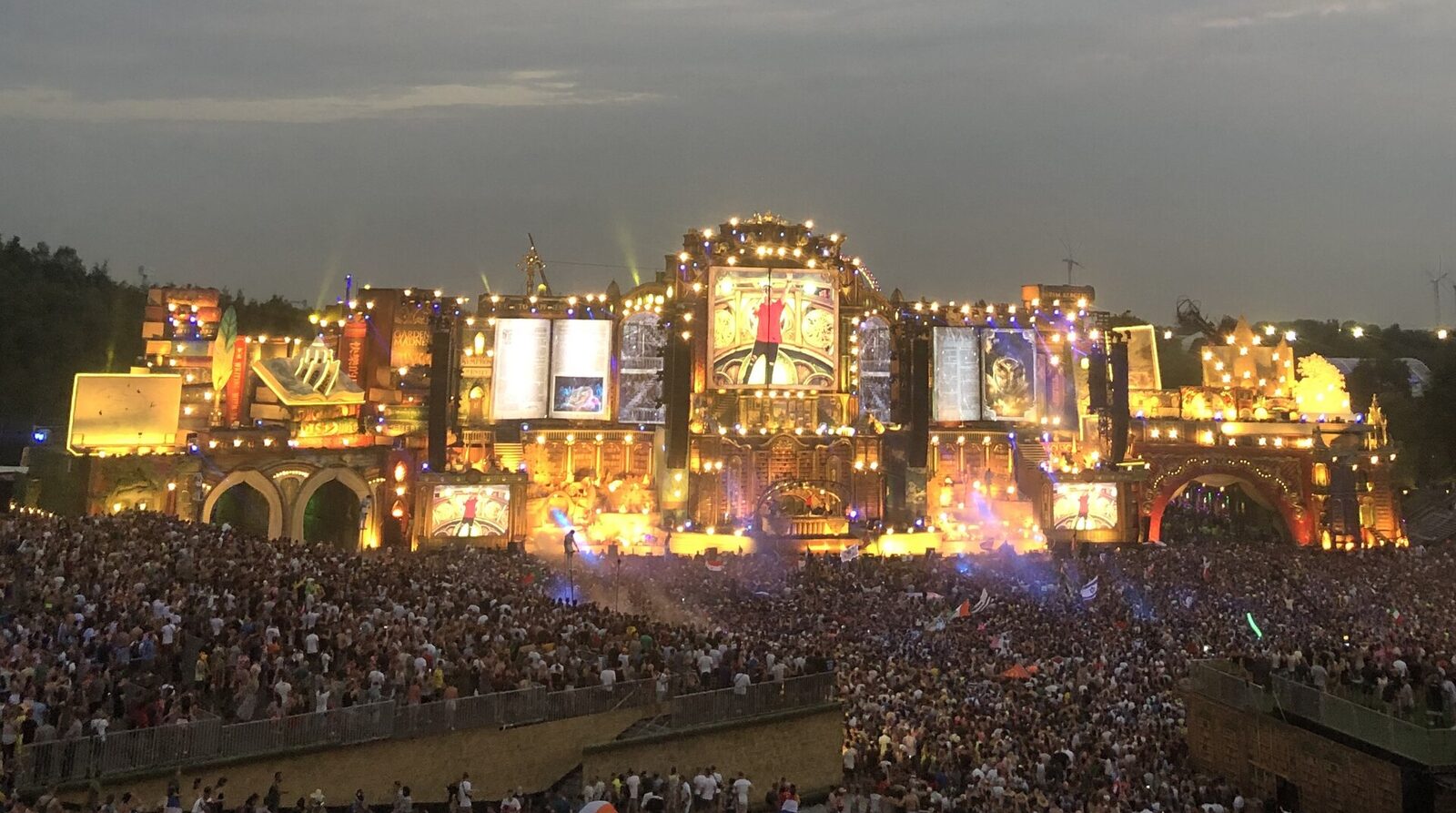 The Tomorrowland mainstage lit up at dusk above a crowd of tens of thousands, the festival format arriving in Pattaya for Thai festivals 2026