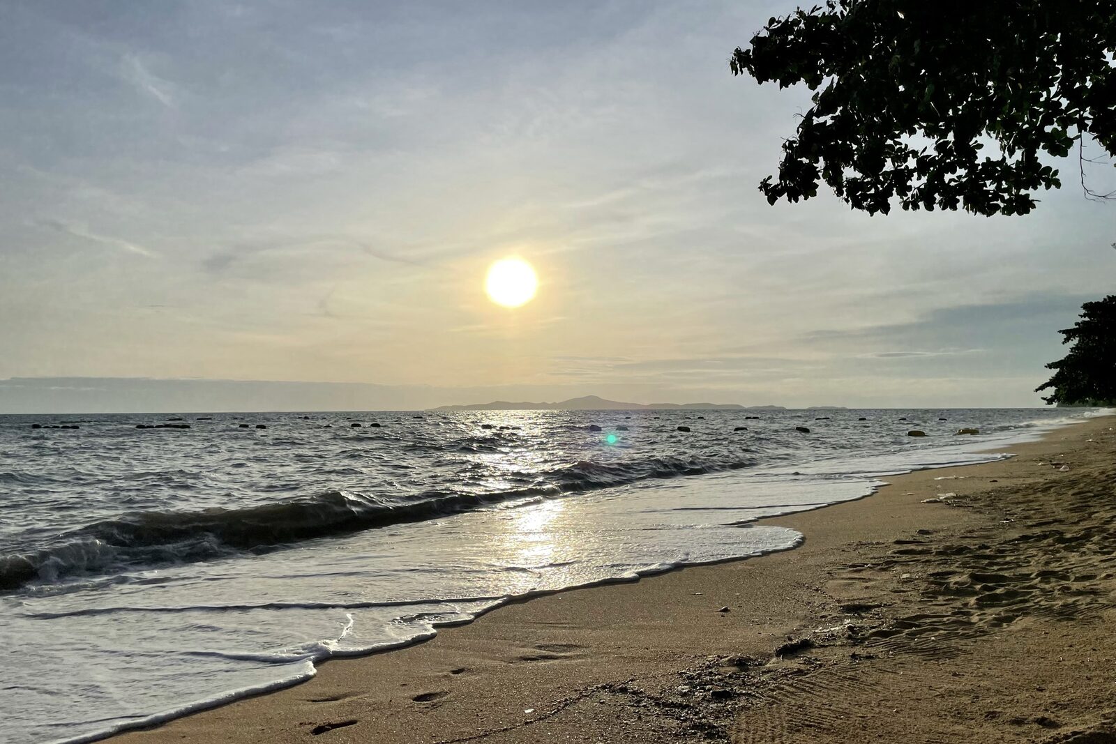 Sunset over the calm water and empty sand of Jomtien Beach near Pattaya, a quieter base among the things to do in Pattaya in December
