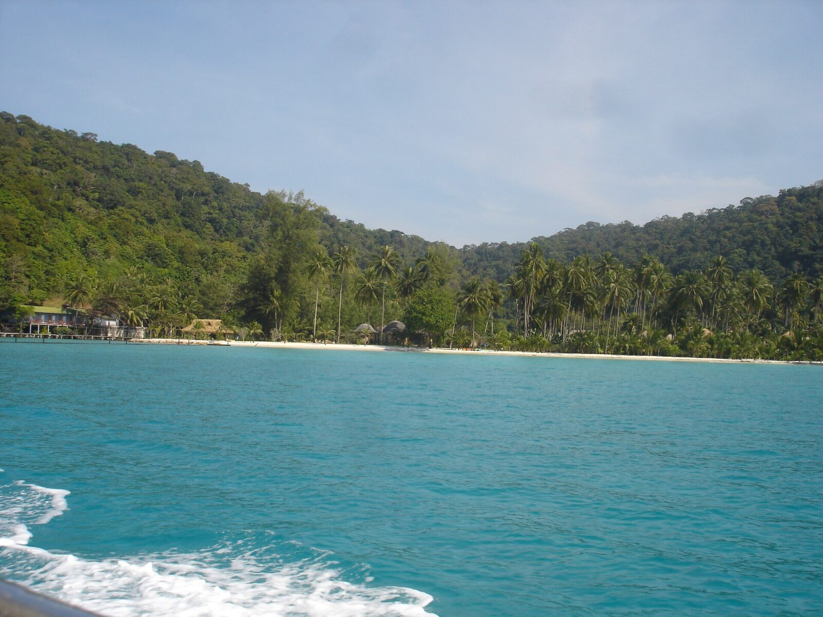 A quiet palm-backed beach on Koh Kood in Trat province seen from a boat, one of the Thailand islands the proposed tourism fund is meant to protect