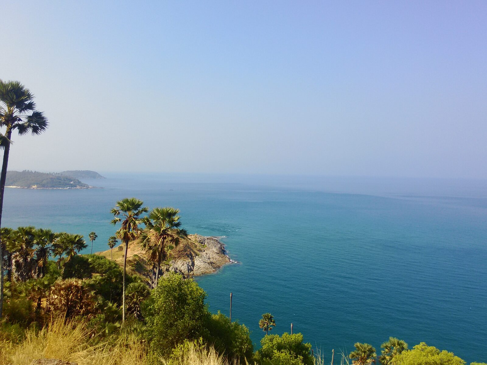 The palm-covered headland of Laem Phromthep at the southern tip of Phuket, looking out over the Andaman Sea