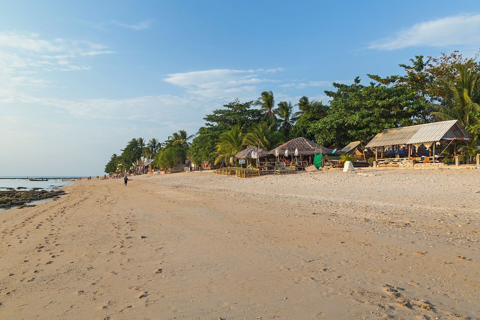 Empty golden sand and beach bars under palm trees at Klong Khong Beach on Ko Lanta Yai in Krabi province, voted the third best island in Asia and one of the best Thailand islands for a quiet holiday