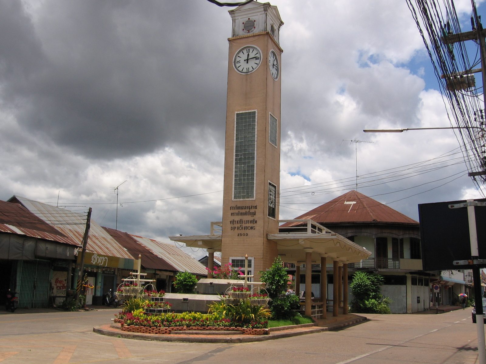 The Vietnamese friendship clock tower in central Nakhon Phanom, a cream-coloured tower above the old shophouses of the Mekong riverside town