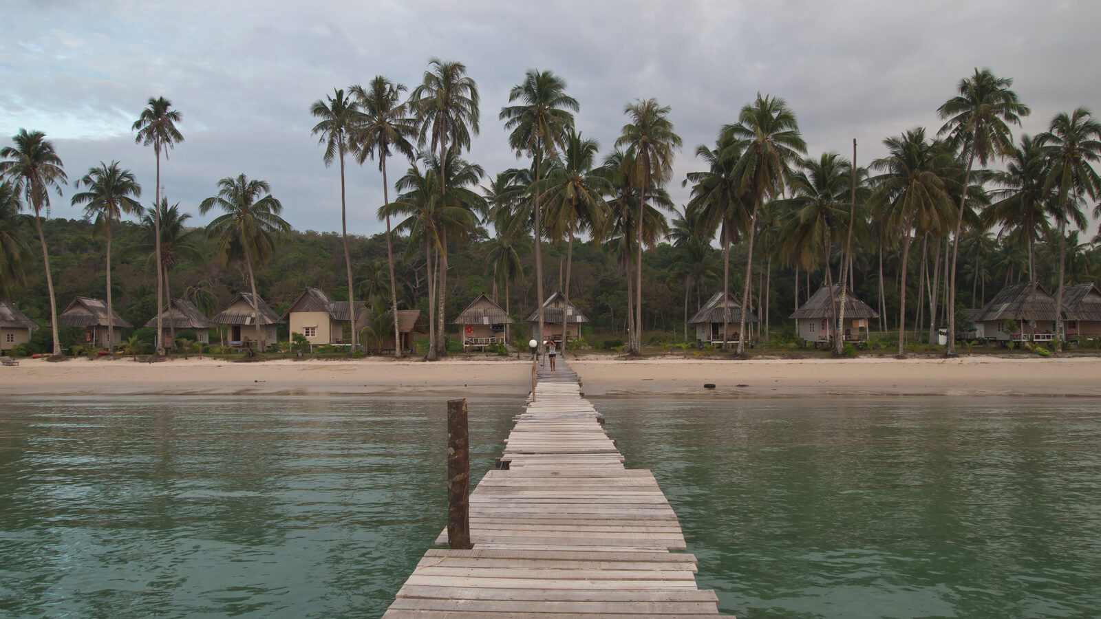 Ao Bang Bao beach on Koh Kood in Trat province, with clear shallow water and coconut palms, one of the best places to visit in Thailand in high season