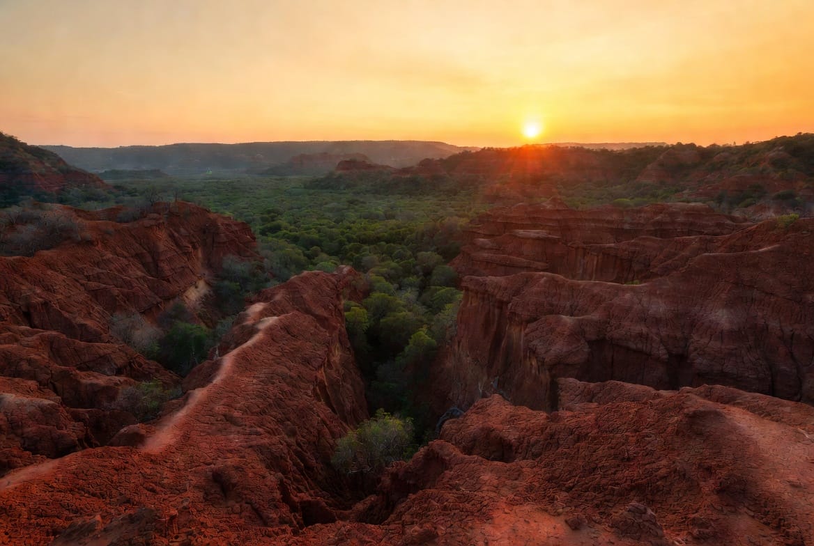 Pai Canyon at sunset with red sandstone ridges and golden light