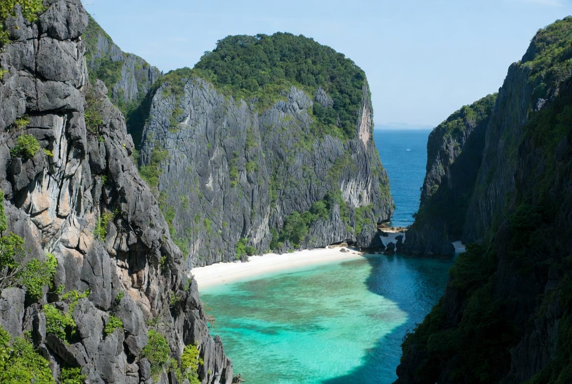 Maya Bay on Koh Phi Phi with steep limestone cliffs and turquoise water
