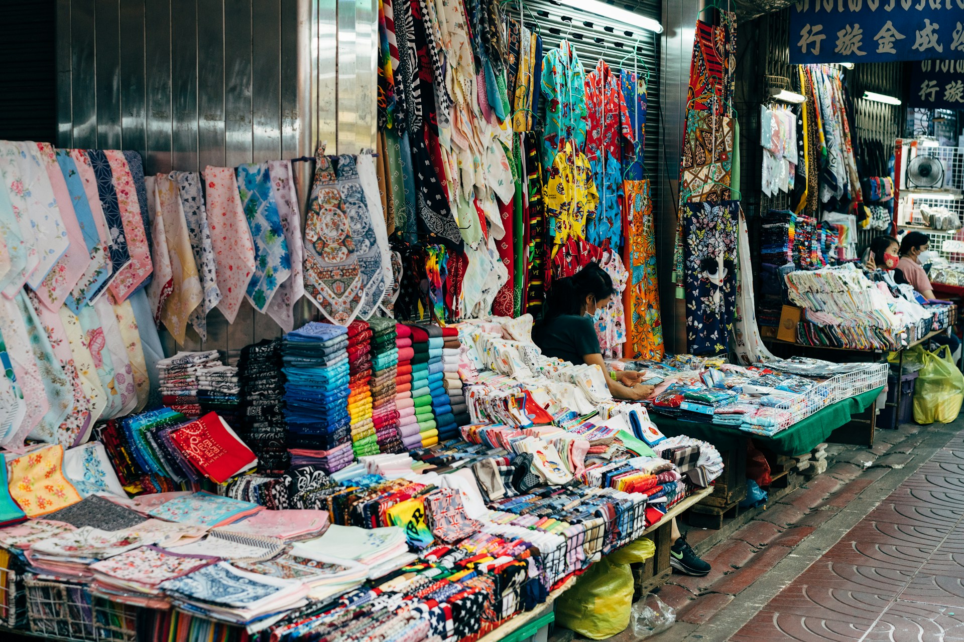 Crowded aisles of Chatuchak Weekend Market in Bangkok with colourful stalls