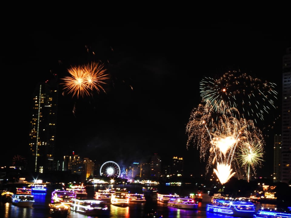 New Year 2019 fireworks over Chao Phraya with Asiatique wheel and boats