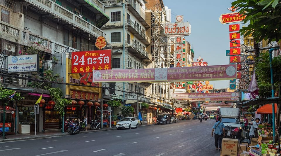 Yaowarat Road in Bangkok's Chinatown, lined with Chinese-Thai shop signs and banners