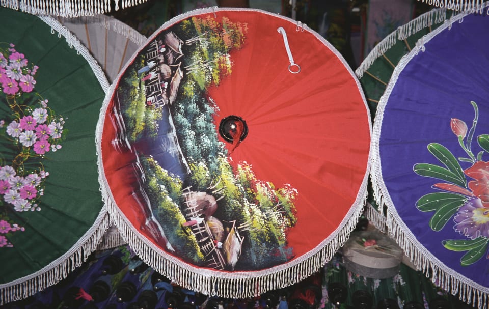 Green, red and blue hand-painted parasols in Bo Sang, Chiang Mai