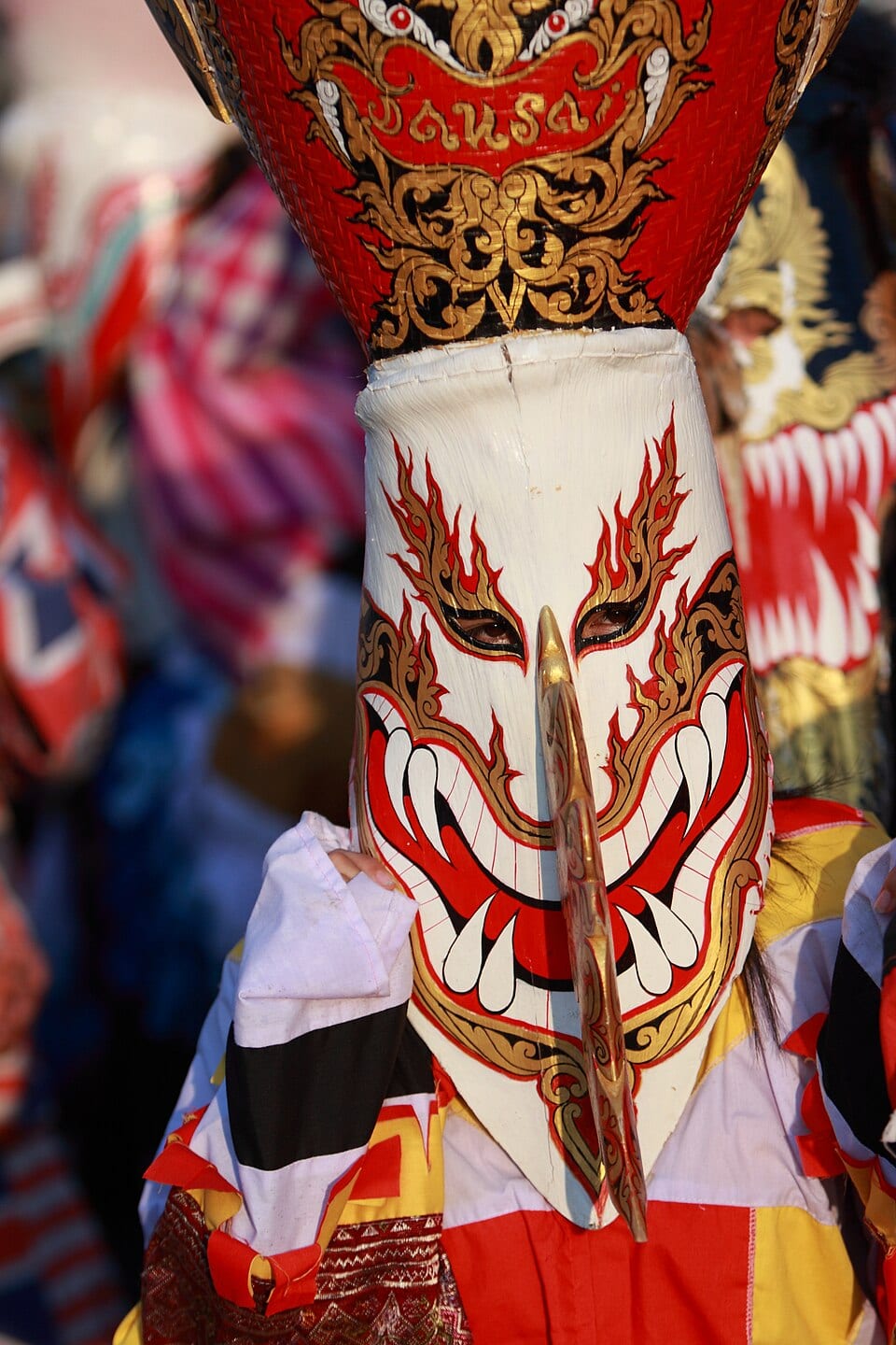 A vividly painted Phi Ta Khon mask at the ghost festival in Dan Sai