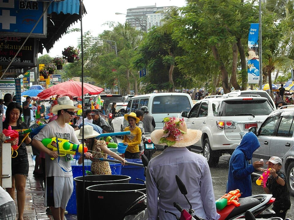 People with water guns and water barrels celebrating Songkran in Pattaya