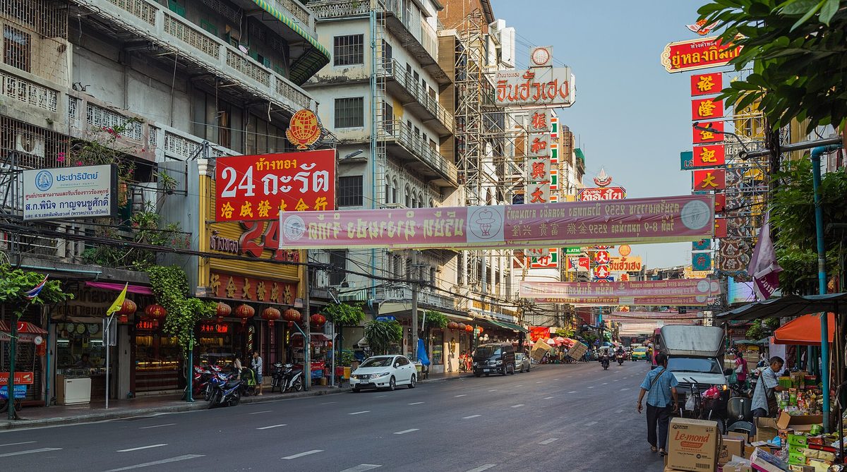 Yaowarat Road in Bangkok's Chinatown, lined with Chinese-Thai shop signs and banners