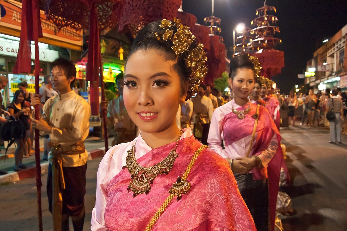 Evening procession with lanterns and traditional dress during the Chiang Mai lantern festival
